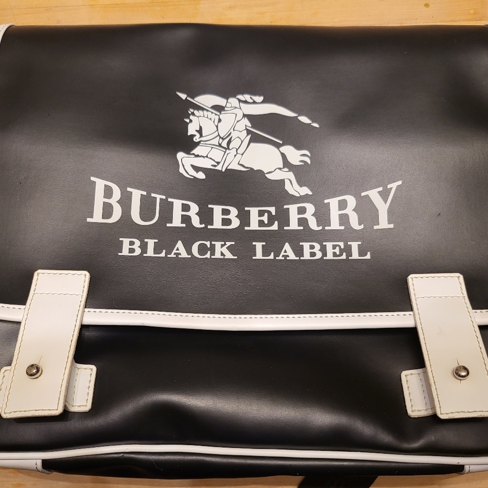 Burberry messenger bag in black & white color.